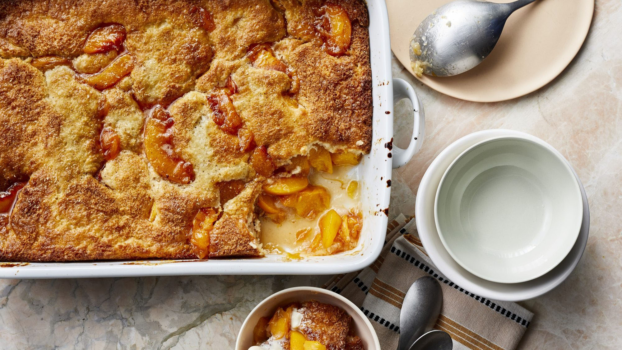 Cobbler is a dessert consisting of a fruit (or less commonly savory) filling poured into a large baking dish and covered with a batter, biscuit, or du...
